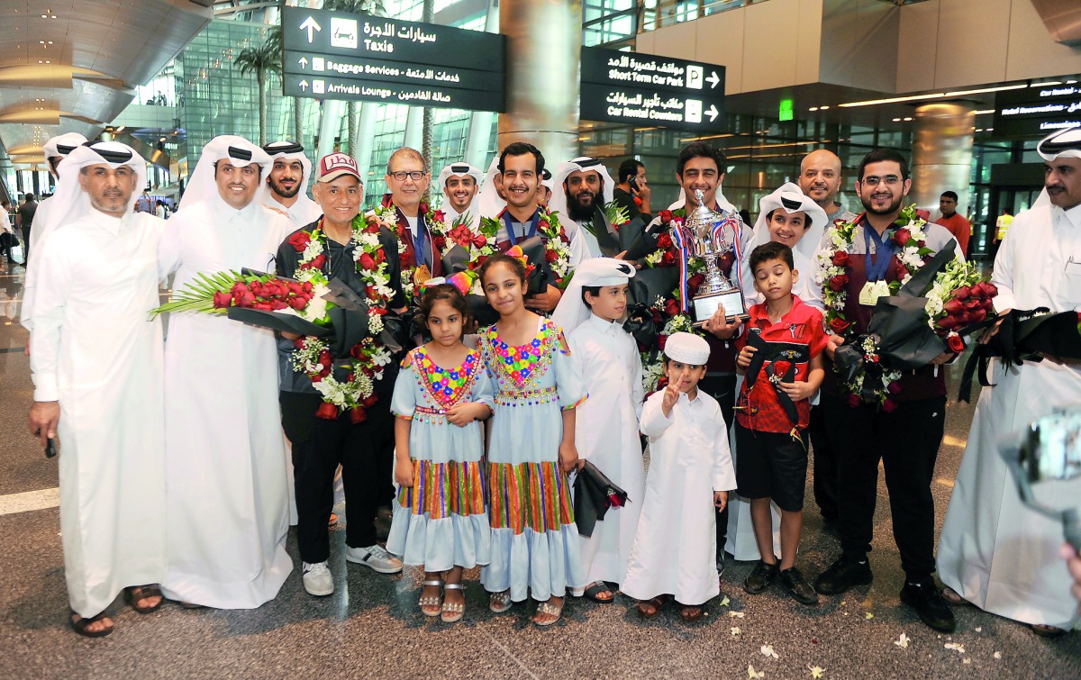 Qatar Bowling Federation officials and fans pose for a photograph with the victorious Qatar bowling team members upon their return from the USA at the Hamad International Airport in Doha yesterday.
Pictures: Abdul Basit / The Peninsula