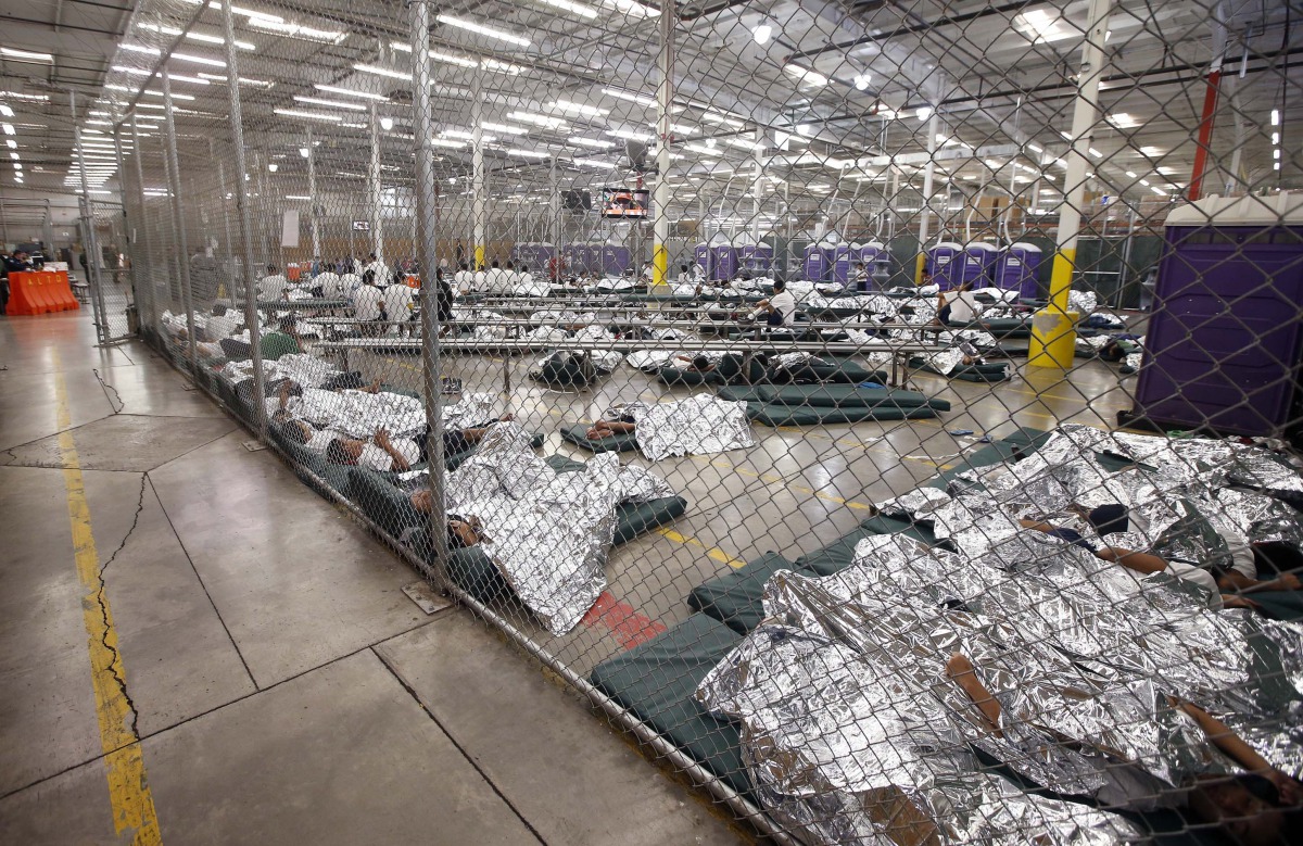 Detainees sleep in a cell where hundreds of mostly Central American immigrant are being processed at the US Customs and Border Protection’s Nogales Placement Center in this file photo. Reuters / Ross D Franklin
