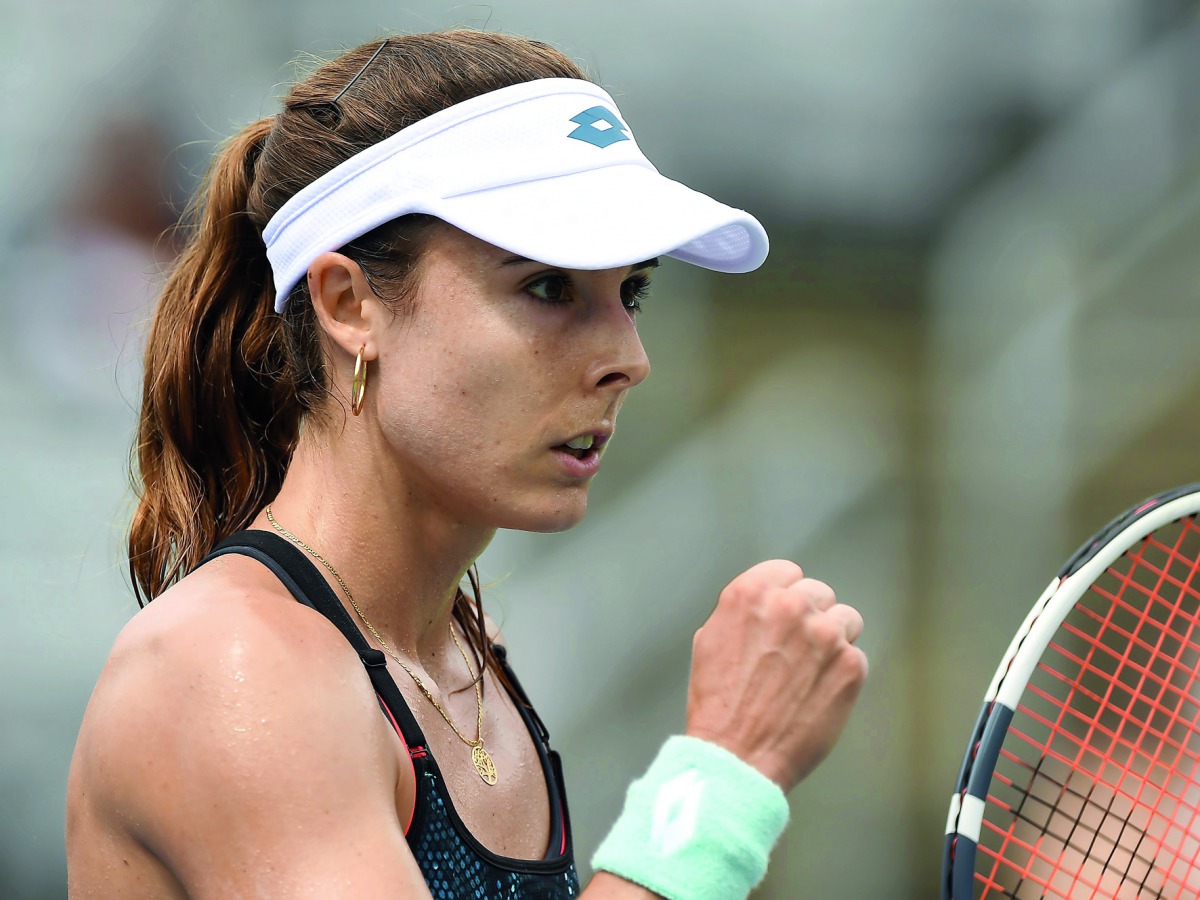 Alize Cornet of France reacts after scoring a point against Angelique Kerber of Germany during day three of the Rogers Cup at IGA Stadium on August 8, 2018 in Montreal, Quebec, Canada. Minas Panagiotakis/Getty Images/AFP