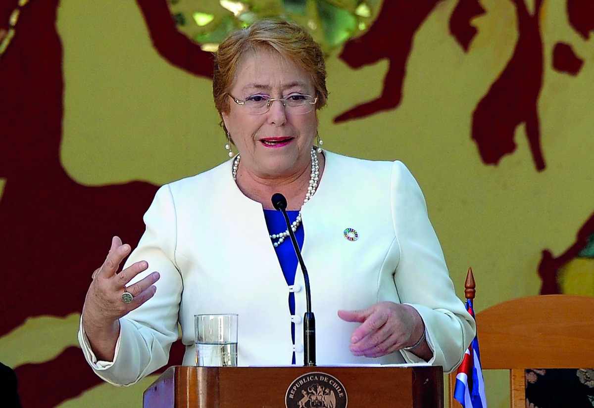 In this file photo taken on January 08, 2018 Chilean President Michelle Bachelet delivers a speech at the Pedagogical School Salvador Allende where she arrived to hand a Chilean national flag, in Havana.  AFP / Yamil Lage
 