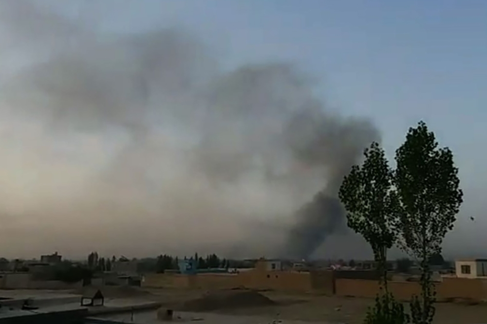 This screen grab taken from AFPTV video on August 10, 2018 shows smoke rising into the air after Taliban militants launched an attack on the Afghan provincial capital Ghazni, with terrified residents cowering in their homes amid explosions and gunfire.  /