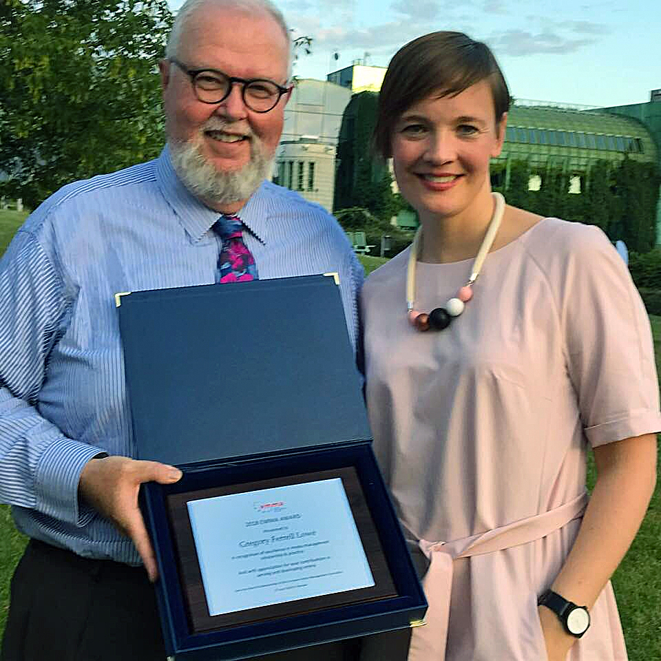 NU-Q’s Gregory Lowe Ferrell (left), receiving the 2018 EMMA Award of Excellence from the association President Ulrike Rohn.