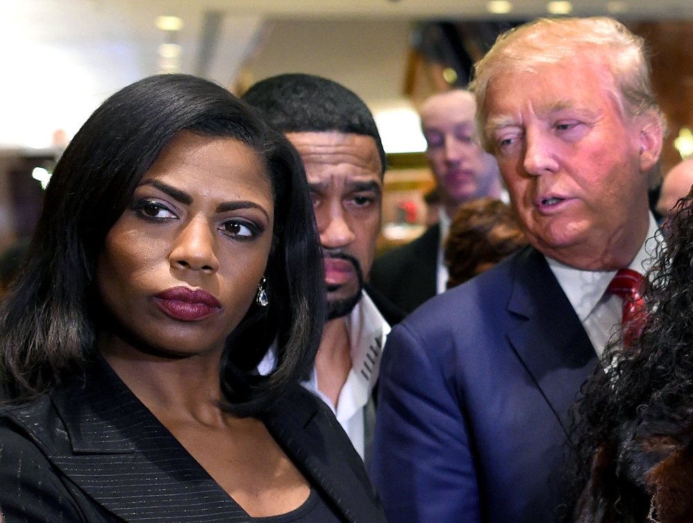 In this file photo, Omarosa Manigault Newman (L) appears alongside Republican presidential hopeful Donald Trump during a press conference that followed Trump's meeting with African-American religious leaders in New York. (AFP / Timothy A. CLARY / File pho