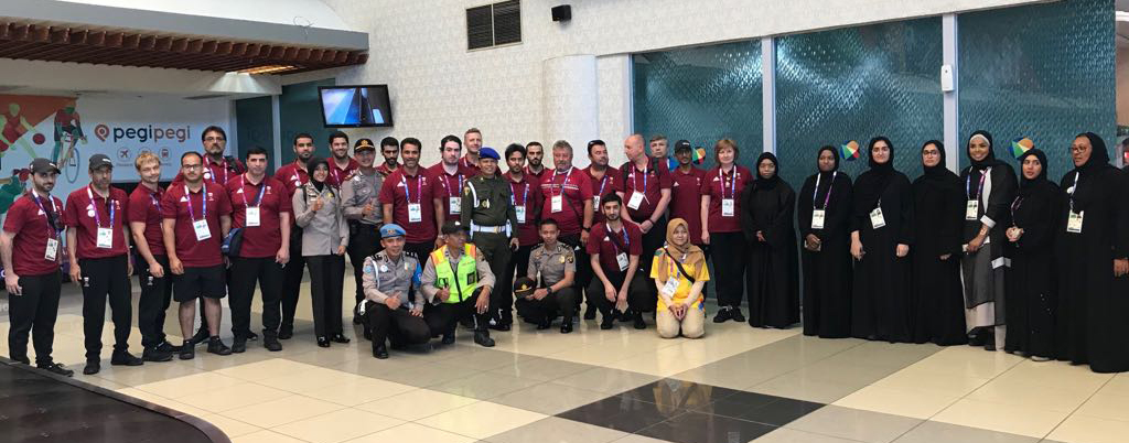 Qatari shooters and archers pose for a photograph with officials upon their arrival in Jakarta, Indonesia yesterday.