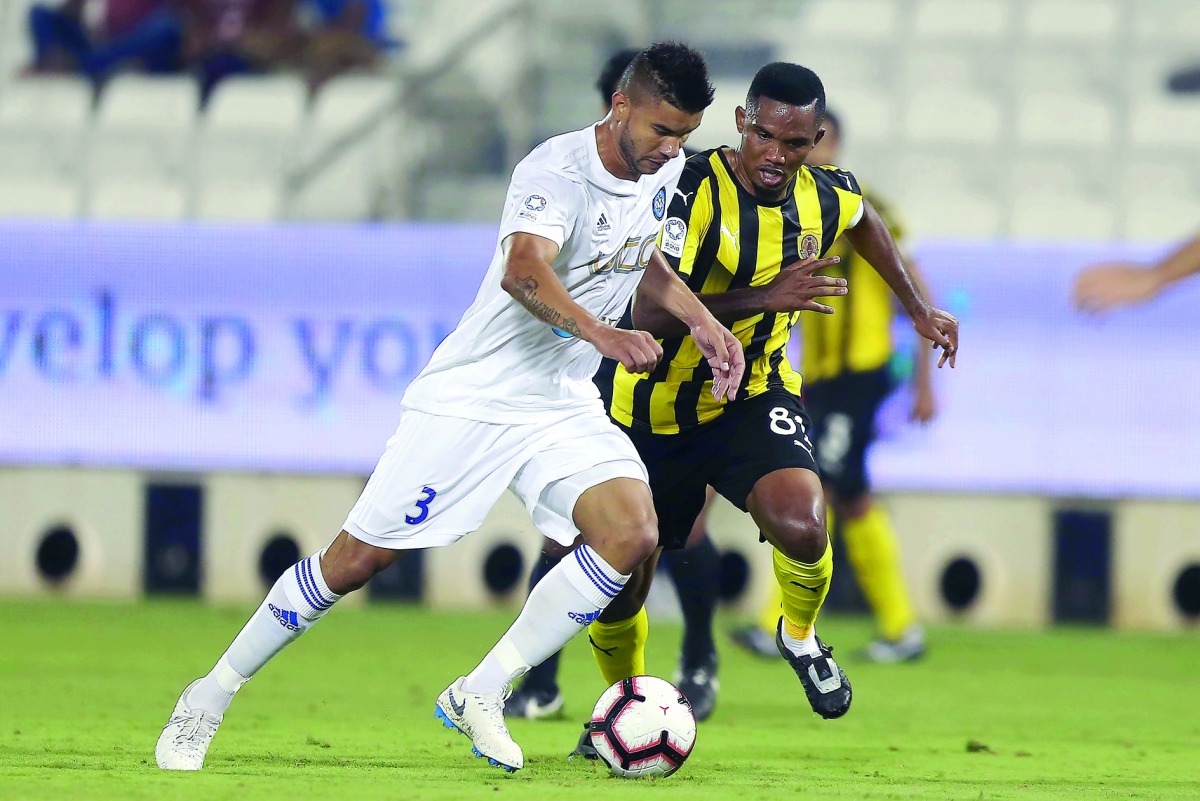 Qatar SC’s Samuel Eto’o vies for ball possession with an Al Sailiya player during their QNB Stars League (QSL) match here yesterday. Picture: Mohamed Farag
