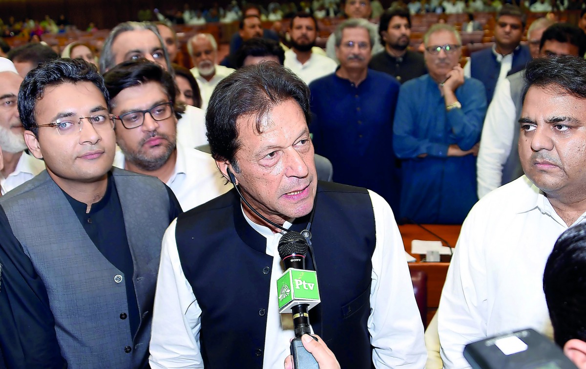 Imran Khan (C), chairman of Pakistan Tehreek-e-Insaf (PTI) political party speaks after he was elected as Prime Minister at the National Assembly (Lower House of Parliament) in Islamabad, Pakistan August 17, 2018. National Assembly Handout via Reuters