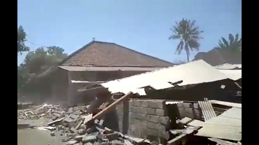 Debris and dust is seen after a building collapsed during an earthquake in lombok, Indonesia, August 19, 2018 in this still image obtained from a social media video. Amre Mogen /via REUTERS 
