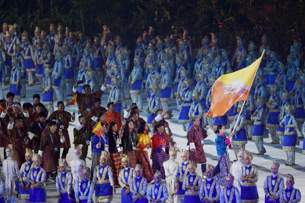 Bhutan's delegation parades during the opening ceremony of the 2018 Asian Games at the Gelora Bung Karno main stadium in Jakarta on August 18, 2018. (AFP / CHAIDEER MAHYUDDIN)