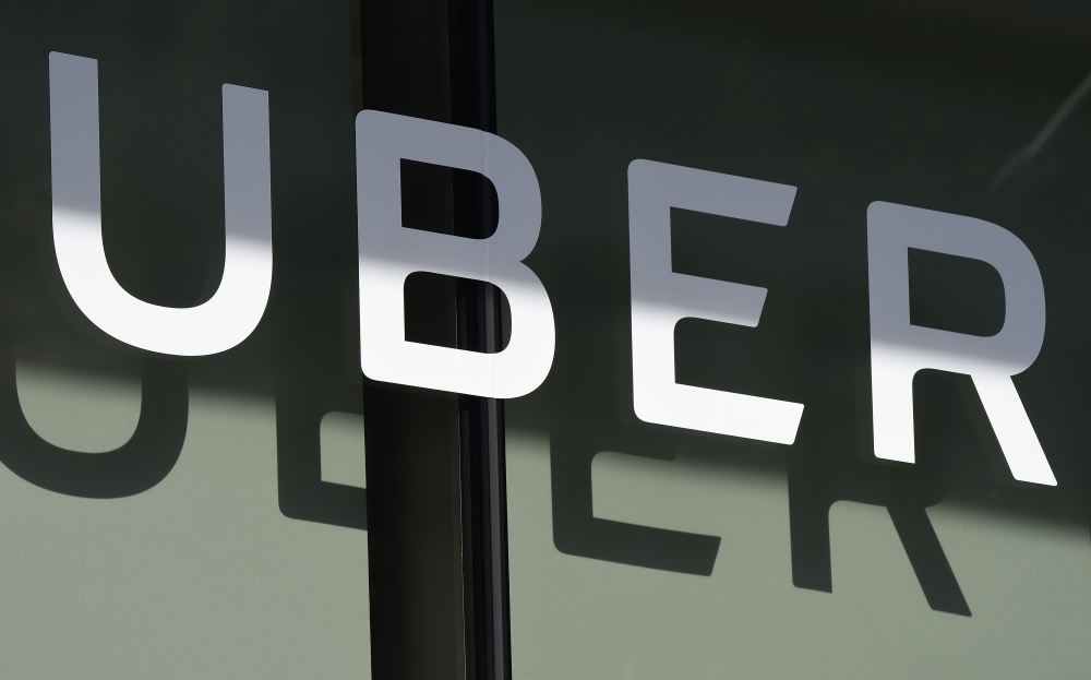  Uber logo is seen at the second annual Uber Elevate Summit at the Skirball Center in Los Angeles, California. (AFP / Robyn Beck)