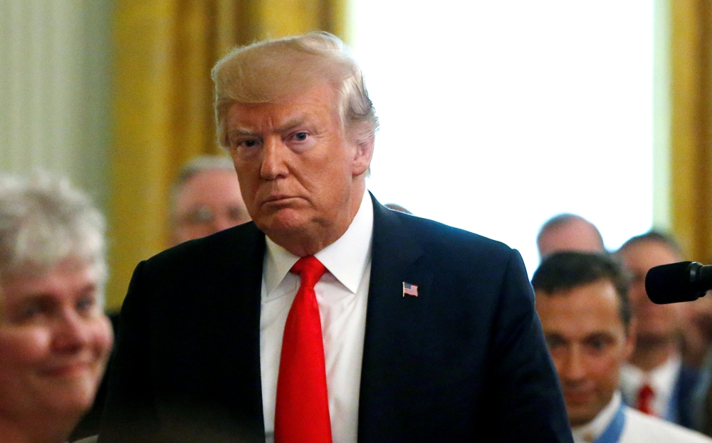 FILE PHOTO: U.S. President Donald Trump departs after awarding a Medal of Honor posthumously to Air Force Technical Sergeant John A. Chapman in the East Room at the White House in Washington, U.S., August 22, 2018. REUTERS/Leah Millis