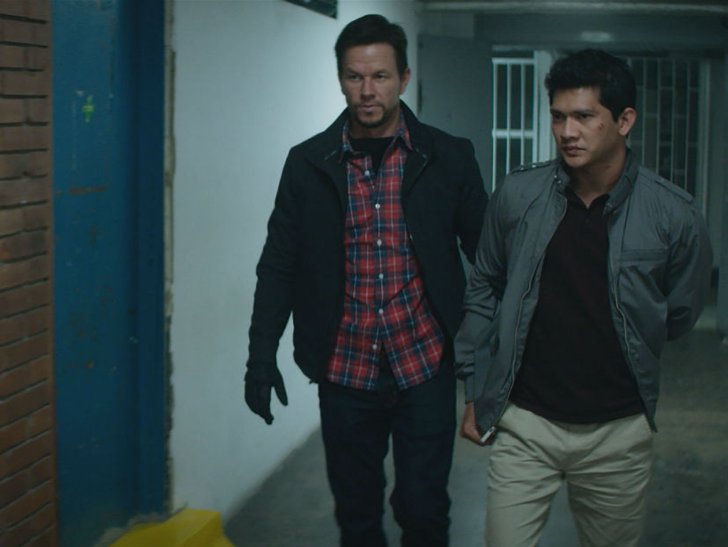 Still of the actors Mark Wahlberg (L) and Iko Uwais (R) from the movie Mile 22.