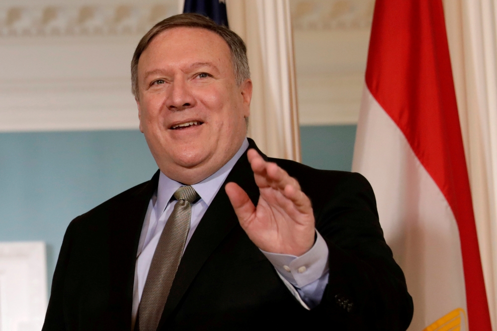 File photo of US Secretary of State Mike Pompeo waves to the media before his meeting with Egyptian Foreign Minister Sameh Shoukry at the State Department in Washington, US, August 8, 2018. REUTERS/Yuri Gripas/File Photo