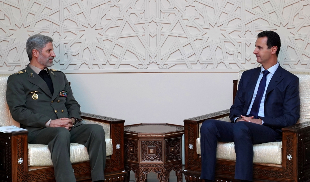 Iranian Defence Minister Amir Hatami (L) meeting with Syrian President Bashar al-Assad (R)in the capital Damascus. AFP / SANA 