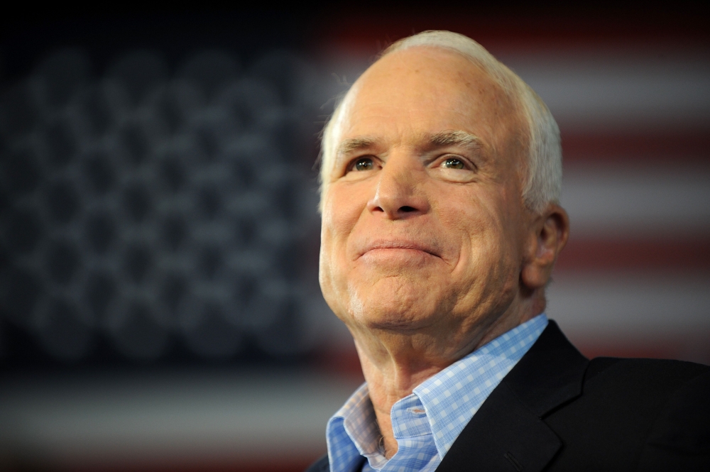Republican presidential candidate John McCain pauses while addressing a campaign event at the Freedom Hill Ampitheatre in Sterling Heights, Michigan, on September 05, 2008. AFP / Robyn Beck

