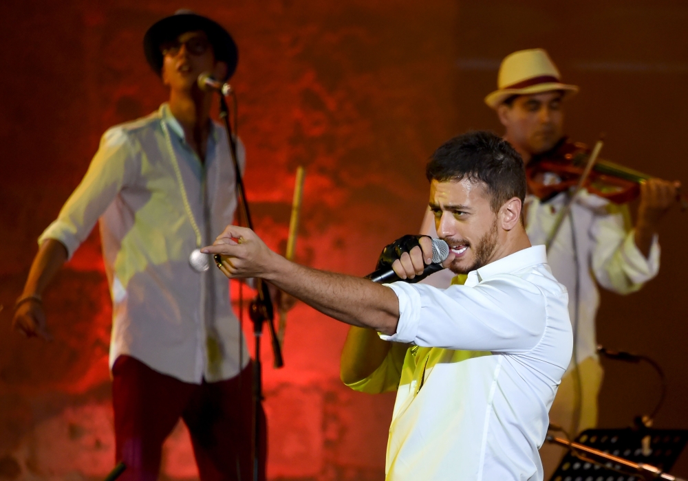 In this file photo taken on July 31, 2016 Moroccan singer Saad Lamjarred performs during the 52nd session of the International Carthage Festival at the Roman Theatre of Carthage, near Tunis. / AFP / FETHI BELAID