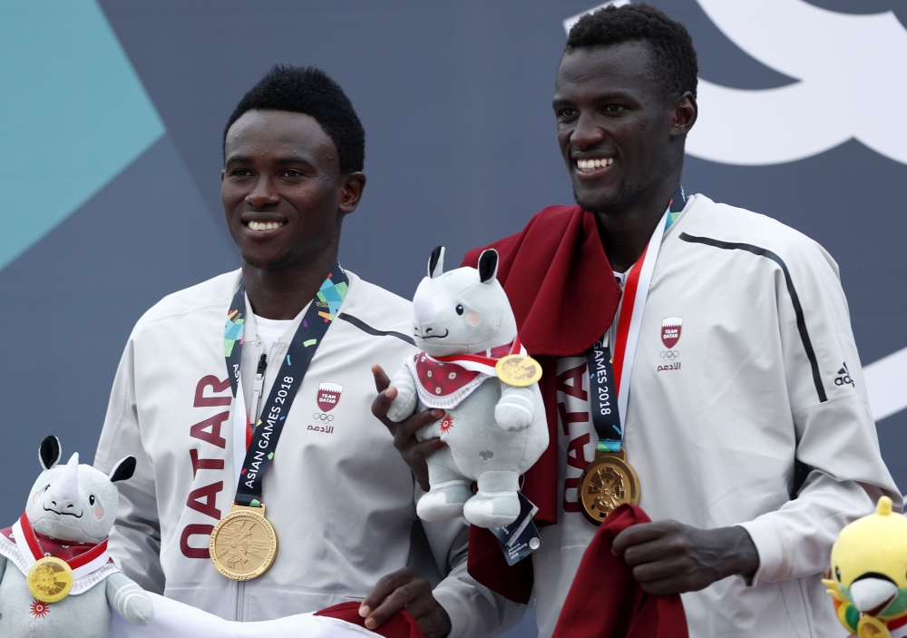 Gold medalists Cherif Younousse Samba and Ahmed Tijan Janko of Qatar pose on the podium. REUTERS/Edgar Su