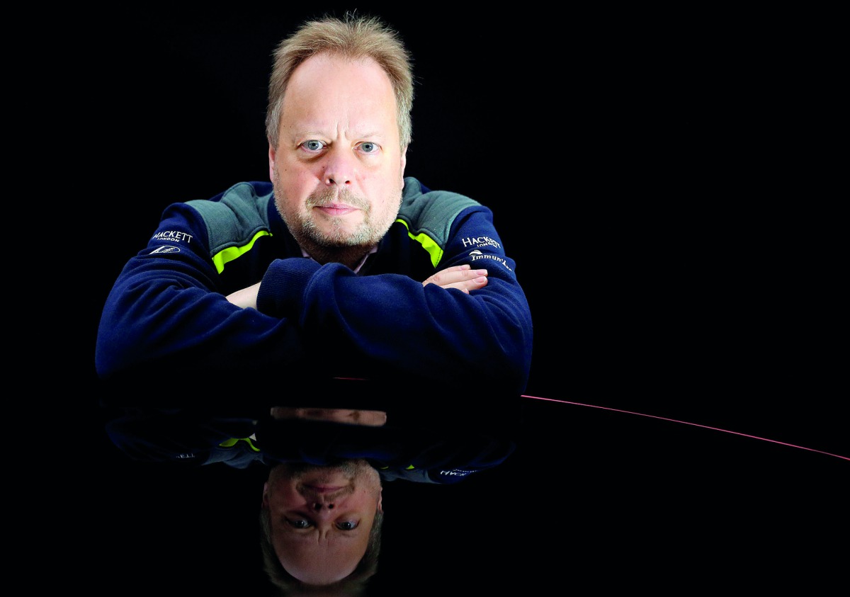 Andy Palmer, CEO of Aston Martin, poses for a photograph next to the company's new Vantage car in Gaydon, Britain November 20, 2017. Reuters/Phil Noble