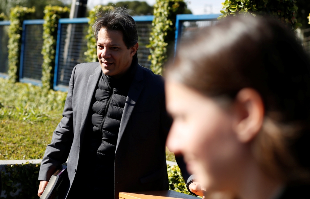 Former Sao Paulo mayor Fernando Haddad arrives at the Federal Police headquarters, where Brazilian former President Luiz Inacio Lula da Silva is imprisoned, in Curitiba, Brazil August 27, 2018. REUTERS/Rodolfo Buhrer