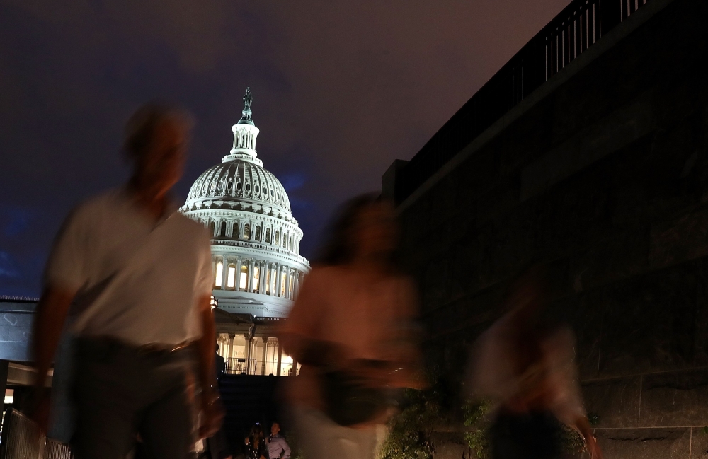 Members of the public leave the U.S. Capitol after paying their respects to the late-Sen. John McCain (R-AZ) as his casket lies in state during a memorial service in his honor at the Rotunda of the U.S. Capitol, August 31, 2018 in Washington, DC. Justin S