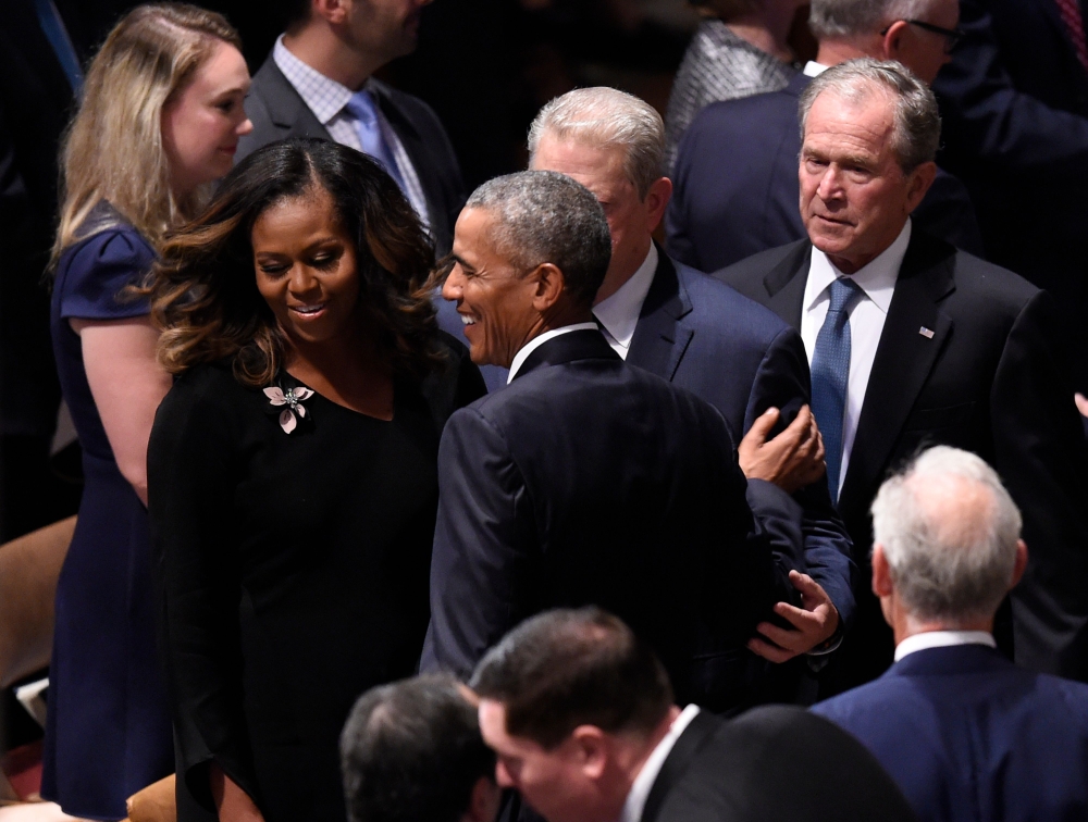 (L-R) Former First Lady Michelle Obama, former US President Barack Obama, former Vice President Al Gore, and former US President George W. Bush arrive for the Memorial Service for US Senator John McCain at the Washington National Cathedral in Washington, 
