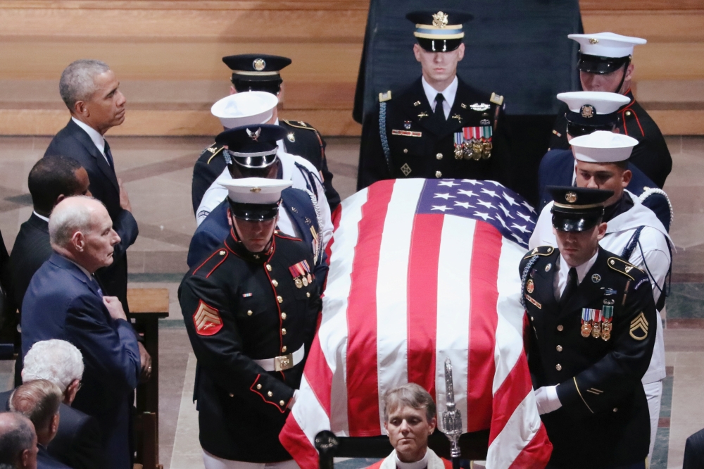 The casket is pictured leaving the memorial service of U.S. Senator John McCain (R-AZ) at National Cathedral in Washington, U.S., September 1, 2018. REUTERS/Chris Wattie