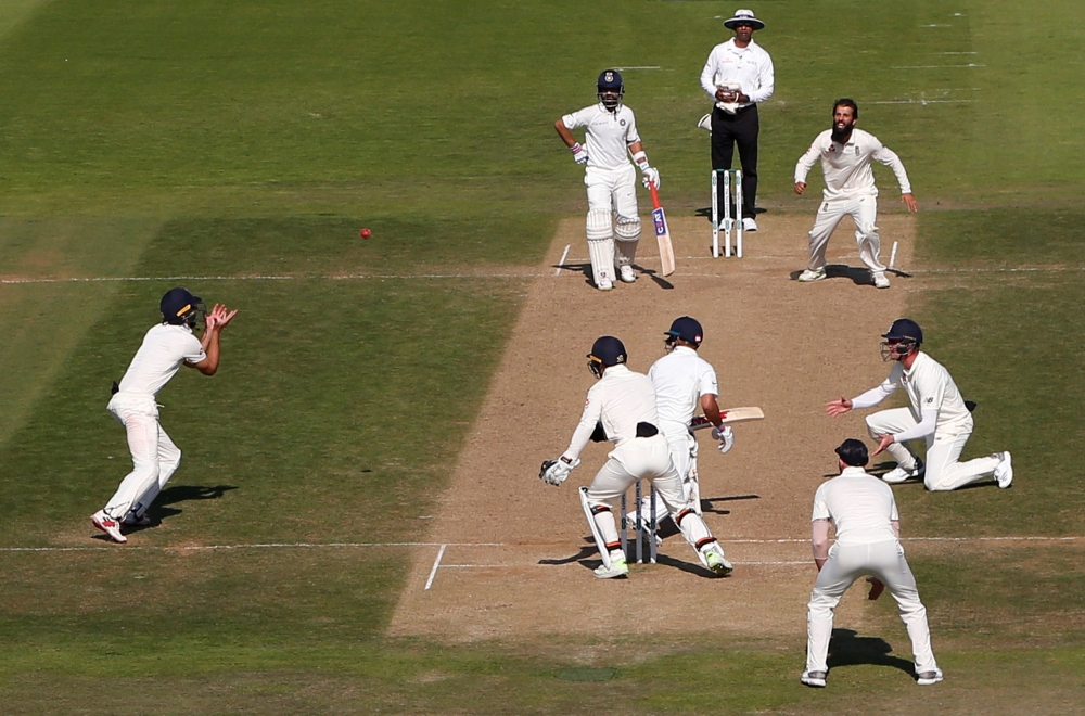 England's Alastair Cook takes a catch to dismiss India's Virat Kohli. Reuters/Paul Childs