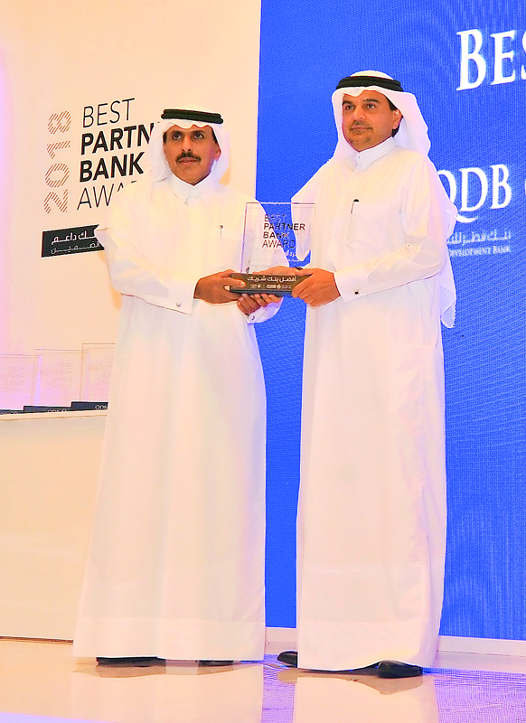 QCB Governor H E Sheikh Abdulla bin Saoud Al Thani (left) presenting the “Best Partner Bank Award” to QIIB’s Chief Executive Officer Dr  Abdulbasit Ahmed Al Shaibei at the event, yesterday.
PIC: Baher Amin/The Peninsula
