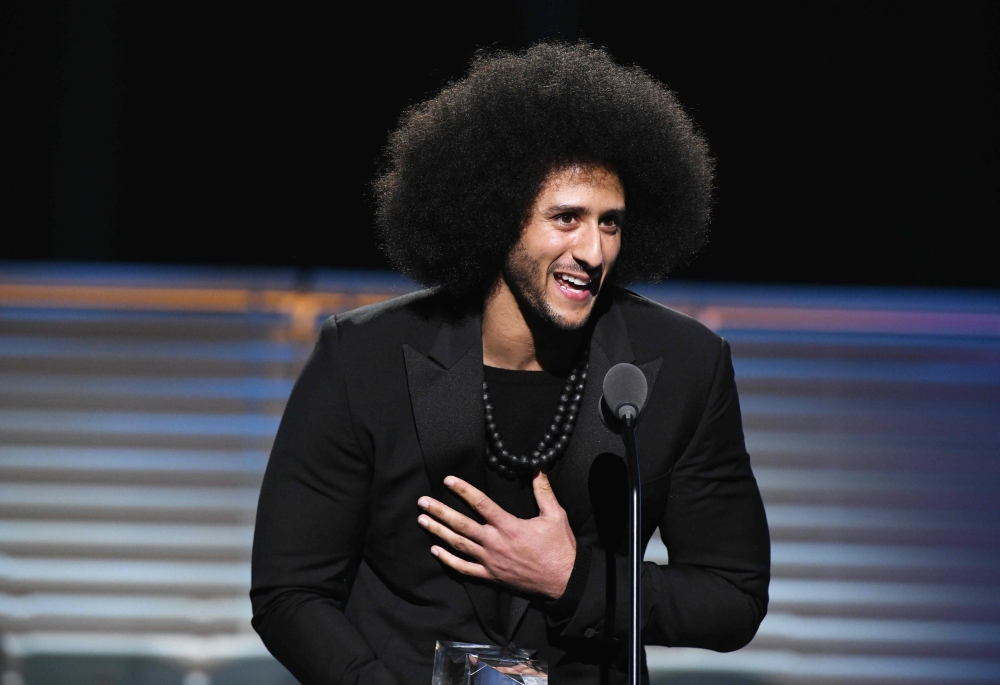 FILE PHOTO: Colin Kaepernick. AFP / Slaven Vlasic
