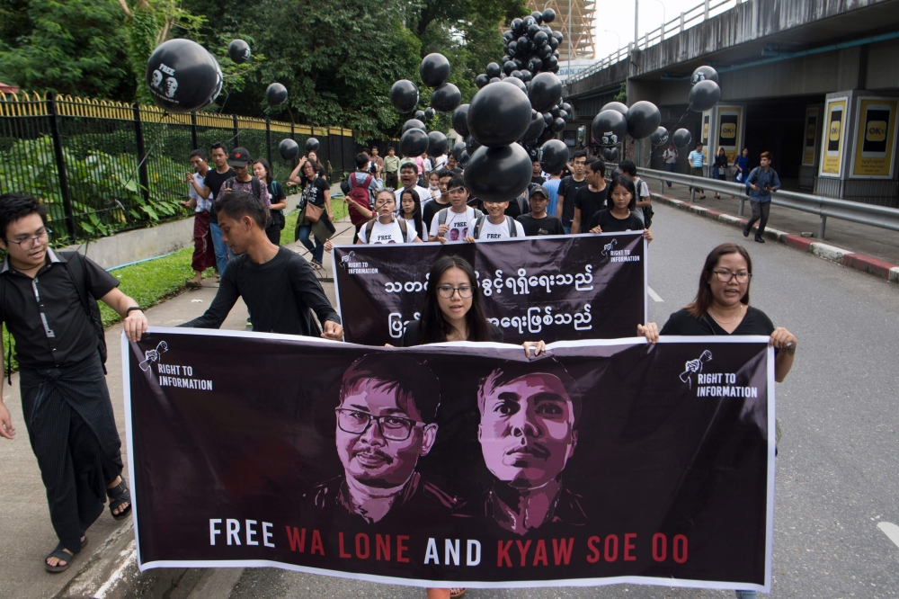 Supporters of detained Myanmar journalists Wa Lone and Kyaw Soe Oo march during a rally in Yangon demanding for their release on September 1, 2018.AFP 