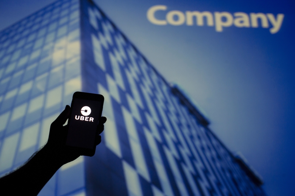 Logo of Uber is seen on a screen of a smartphone in Ankara, Turkey on September 1, 2018. Emin Sansar - Anadolu