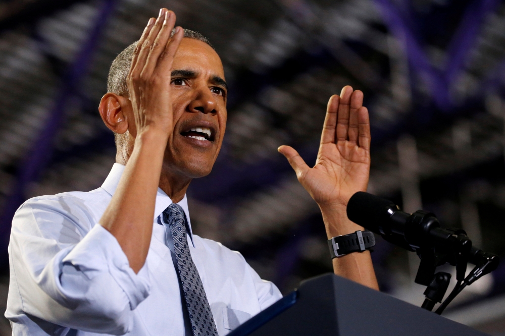 Barack Obama participates in a 