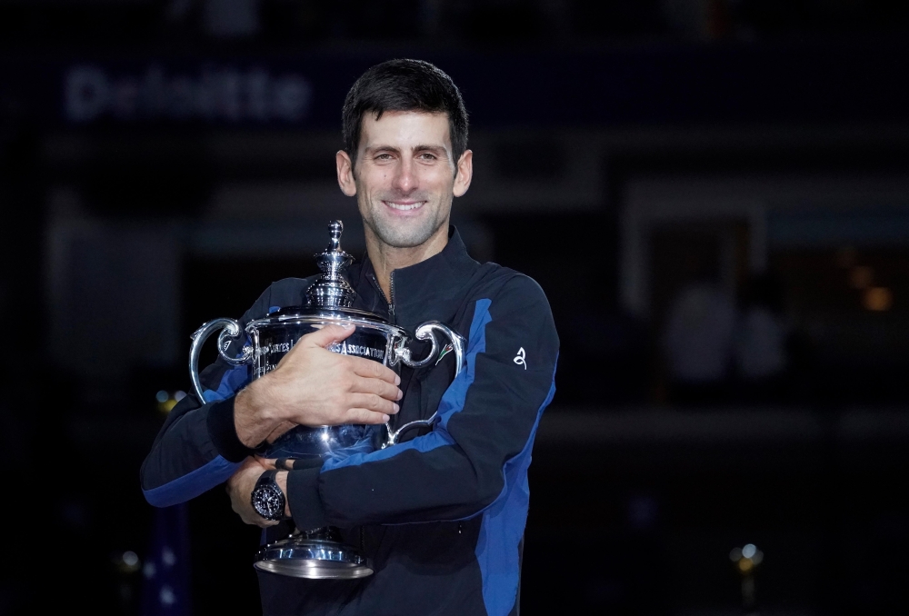 Novak Djokovic of Serbia poses with the U.S. Open trophy after beating Juan Martin del Potro of Argentina in the men's final on day fourteen of the 2018 U.S. Open tennis tournament at USTA Billie Jean King National Tennis Center. Mandatory Credit: Robert 