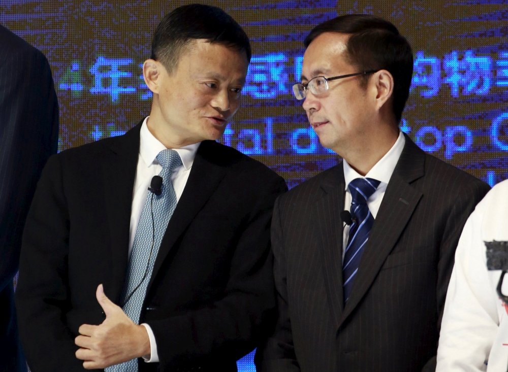 File photo: Alibaba Founder and Chairman Jack Ma (L) talks to CEO Daniel Zhang at NYSE Bell Ringing ceremony during Alibaba Group's 11.11 Global shopping festival in Beijing, China, November 11, 2015. Reuters/Kim Kyung-Hoon/File Photo