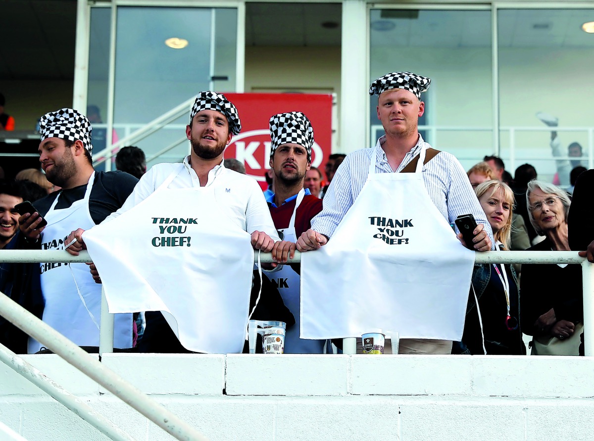 Fans wear aprons that display a message (Action Images via Reuters/Paul Childs)  