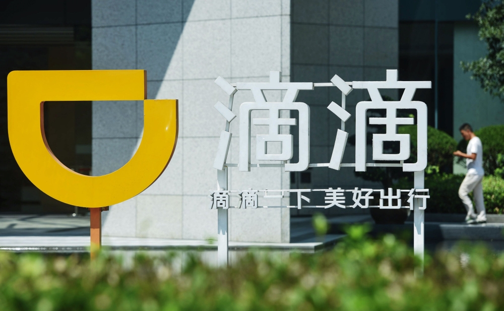 This file picture taken on September 4, 2018 shows a logo of Didi Chuxing in Hangzhou in China's eastern Zhejiang province. China OUT / AFP / STR 