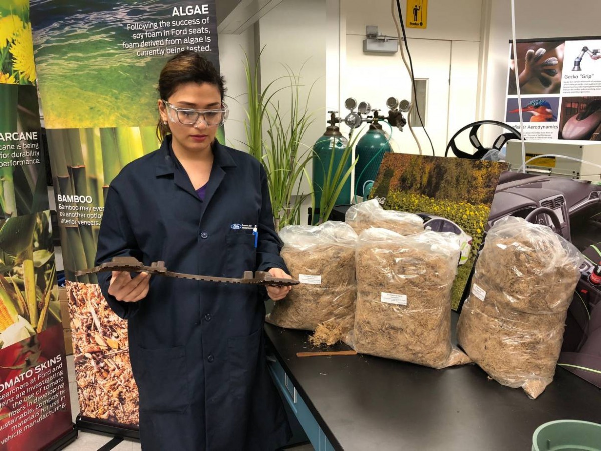 Shokoofeh Ghasemi, an intern at Ford, holds an agave fibre reinforced car part at the manufacturer's research laboratory in Dearborn, Michigan on August 31, 2018. Thomson Reuters Foundation/ Dinesha Ganesarajan