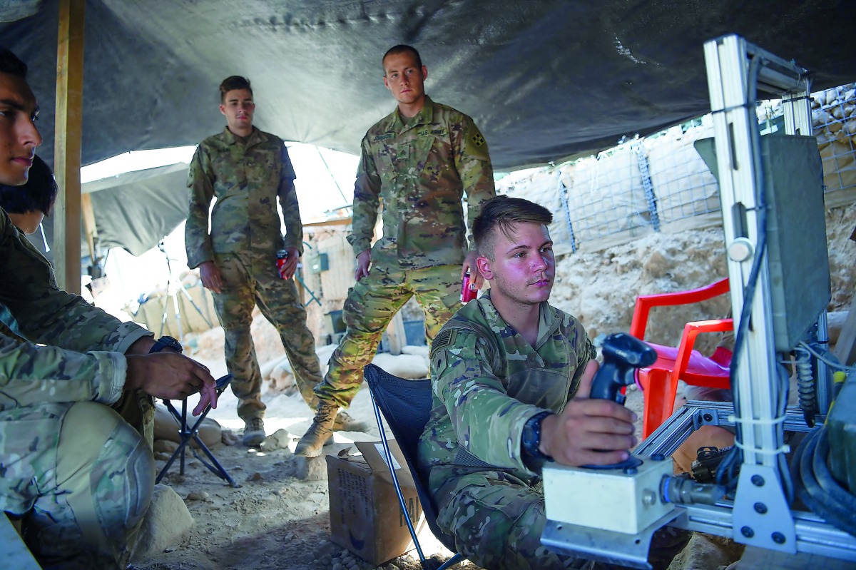 US Army soldiers from NATO looks on as they use a cruise system in a checkpoint during a patrol against Islamic State militants at the Deh Bala district in the eastern province of Nangarhar Province on July 07, 2018. AFP / Wakil Kohsar