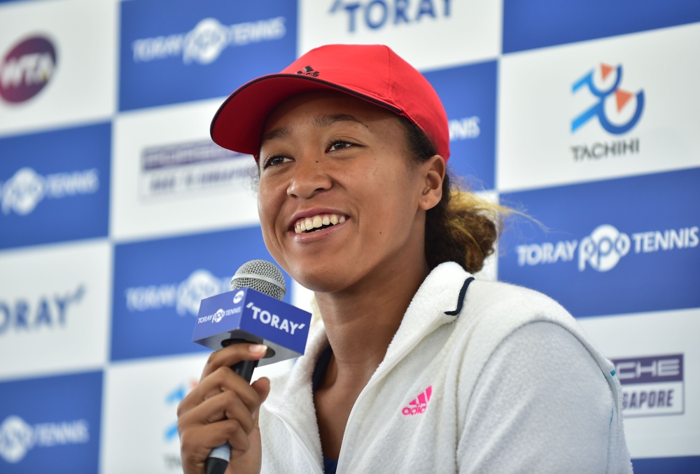 US Open champion Naomi Osaka of Japan answers questions during a press conference for the Pan Pacific Open tennis tournament in Tokyo on September 17, 2018. / AFP / Kazuhiro NOGI