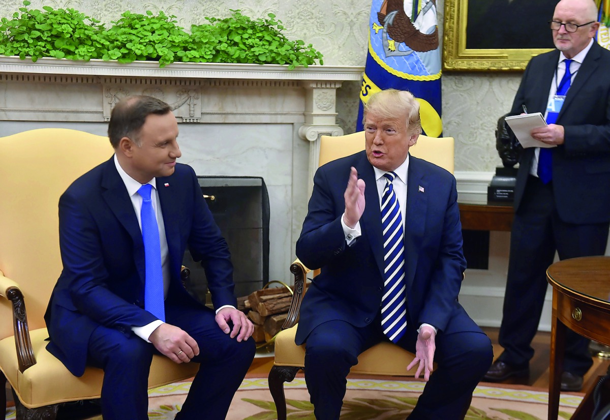 US President Donald Trump and Polish President Andrzej Duda(L)speak to the media in the Oval office at the White House on September 18, 2018 in Washington,DC. AFP / Nicholas Kamm