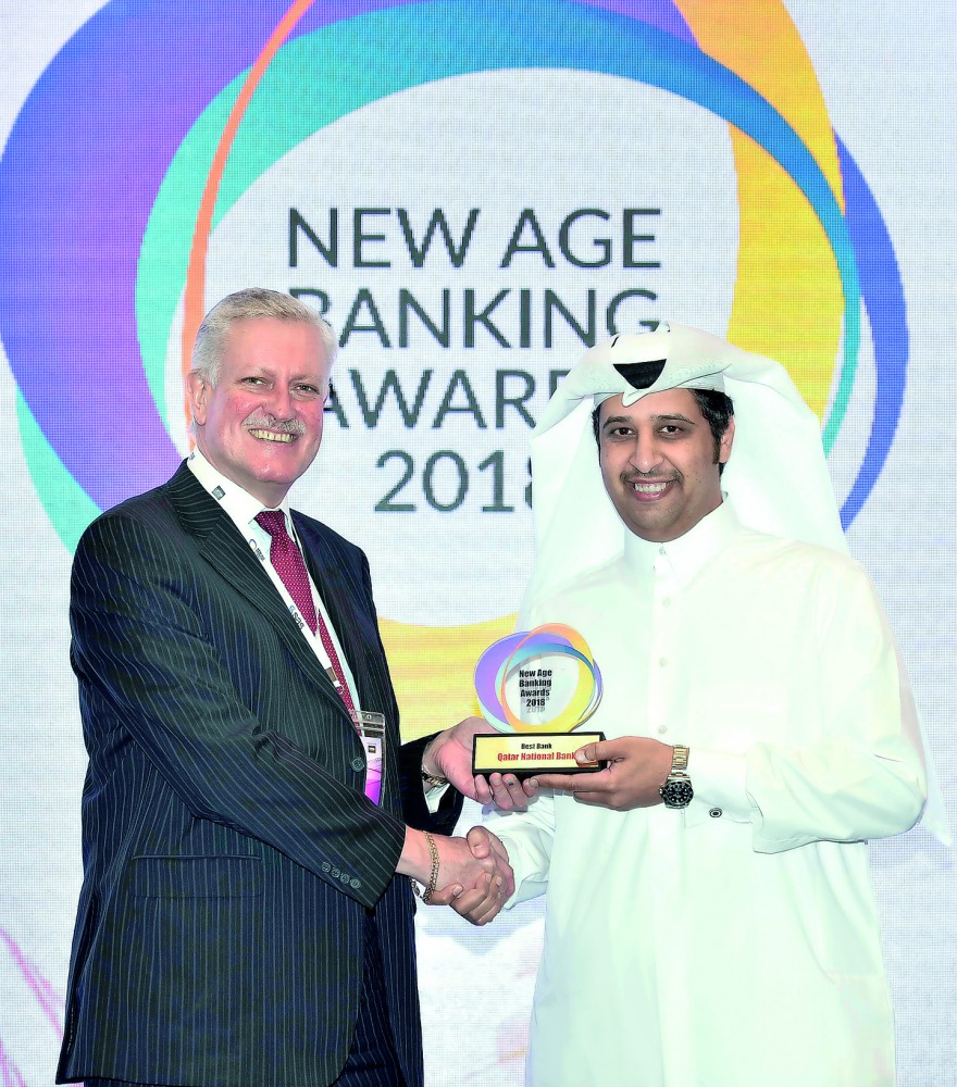 A QNB official (right) receiving the ‘Best Bank’ recognition, on behalf of the bank, at the New Age Banking Awards 2018 ceremony.