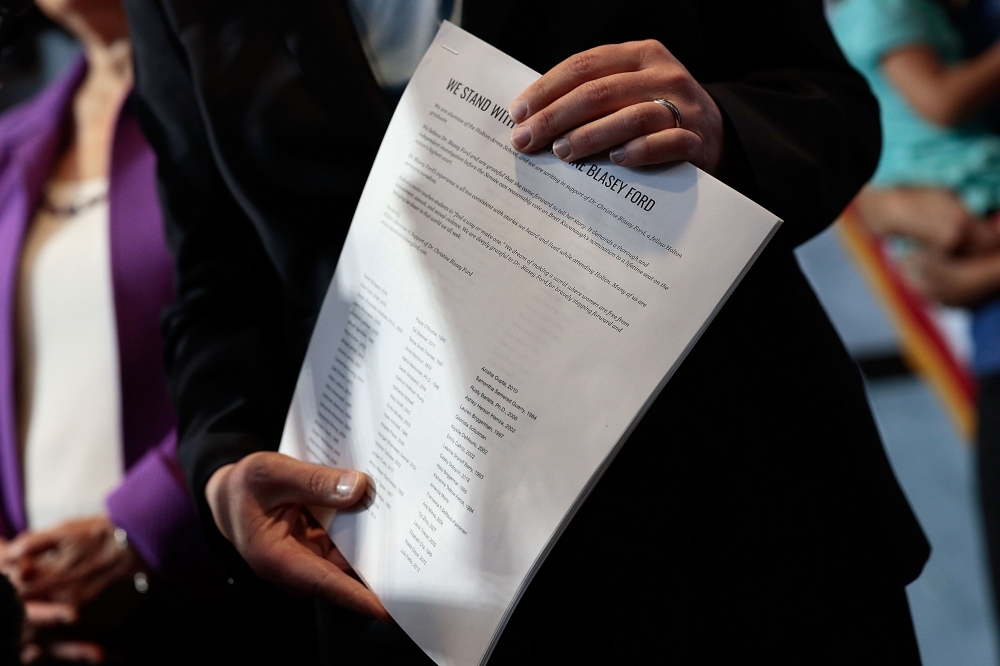 Senator Kirsten Gillibrand (D-NY) holds a letter signed by Holton-Arms alumnae in support of Christine Blasey Ford, who has accused Supreme Court nominee Judge Brett Kavanaugh of sexual assault at a high school party about 35 years ago, September 20, 2018