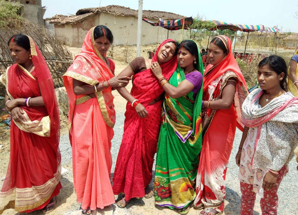 In this photograph taken on May 5, 2018 Indian relatives mourn following the rape and murder of a 16-year-old girl on May 3, at Raja Kundra Village in Chatra district of the eastern Indian state of Jharkhand (AFP) 