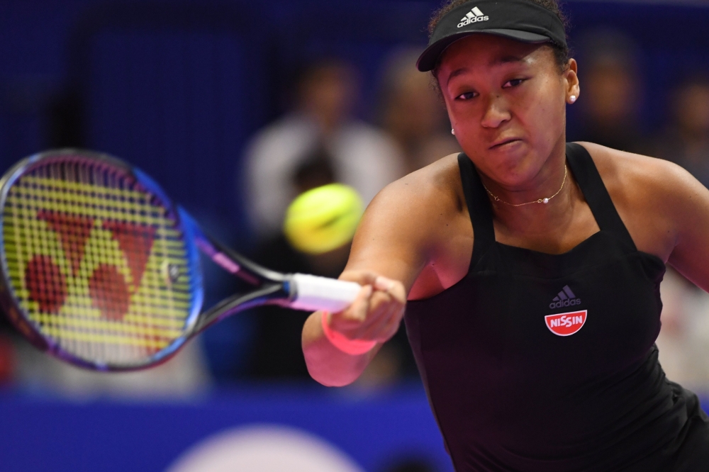Japan's Naomi Osaka hits a return against Karolina Pliskova of the Czech Republic during their women's singles final at the Pan Pacific Open tennis tournament in Tokyo on September 23, 2018. AFP / Toshifumi Kitamura 