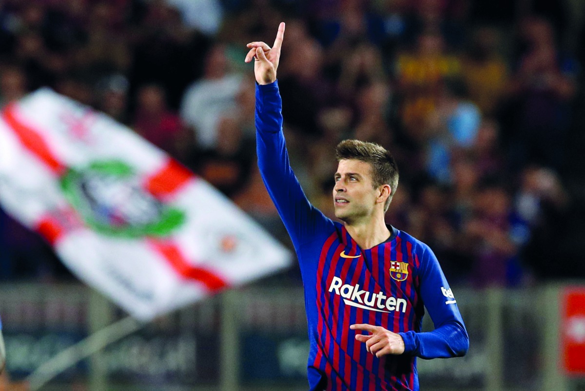 Barcelona's Gerard Pique celebrates scoring their second goal. Reuters/Albert Gea