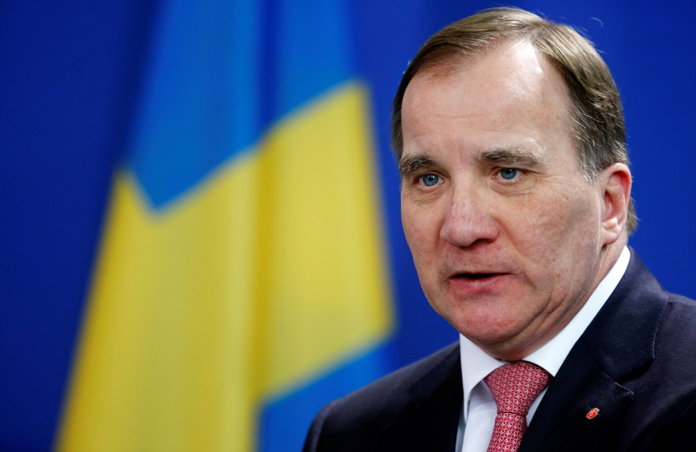 FILE PHOTO: Swedish Prime Minister Stefan Lofven addresses a news conference after talks with German Chancellor Angela Merkel at the chancellery in Berlin, Germany, March 16, 2018. REUTERS/Hannibal Hanschke/File Photo