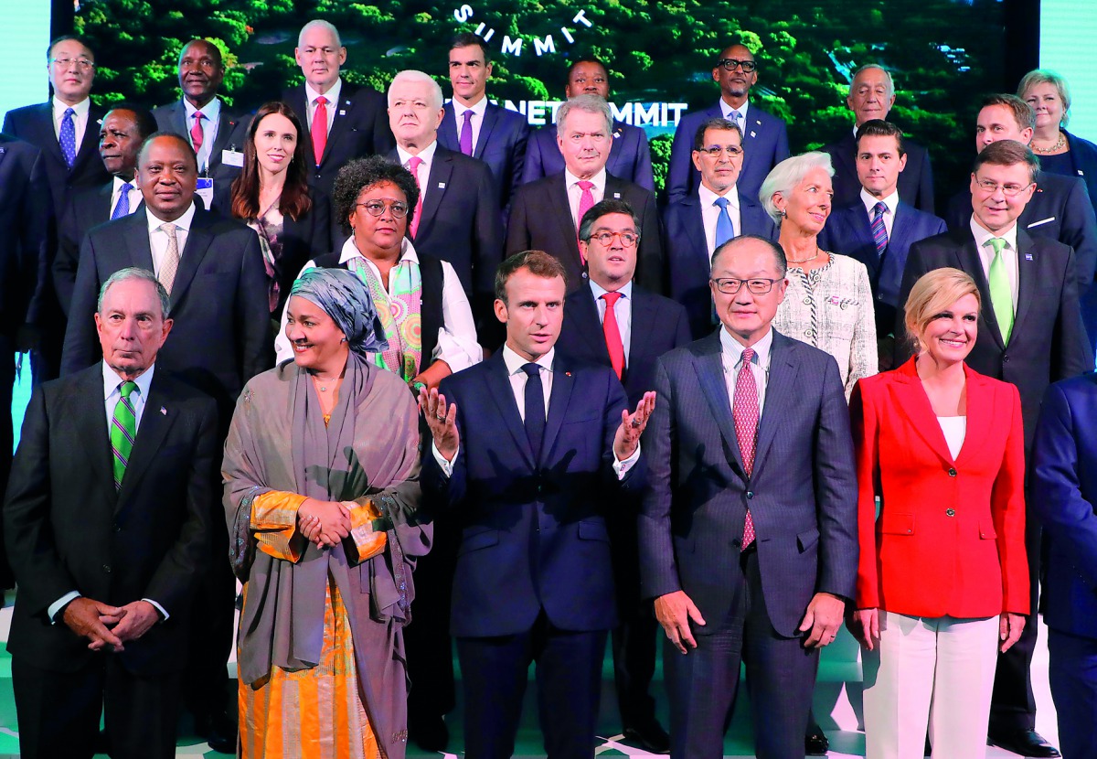 (L-R front) Former New York Mayor Michael R. Bloomberg, Deputy Secretary-General of the United Nations Amina J. Mohammed, French President Emmanuel Macron, World Bank President Jim Yong Kim, and President of Croatia Kolinda Grabar-Kitarovic pose for a pho