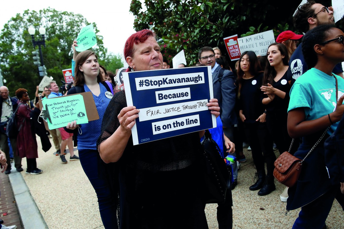 Protesters rally before a hearing where Christine Blasey Ford will testify about an accusation that U.S. Supreme Court nominee Brett Kavanaugh sexually assaulted her in 1982 on Capitol Hill in Washington, U.S., September 27, 2018. Reuters/Joshua Roberts