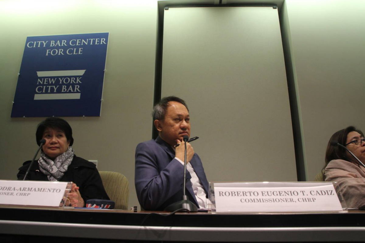 Philippines' Human Rights commissioners Leah Tanodra-Armamento (left) and Roberto Eugenio Cadiz (center) listen to expert testimonies at a hearing held at the New York City Bar Association in New York City, September 27, 2018. Thomson Reuters Foundation/S