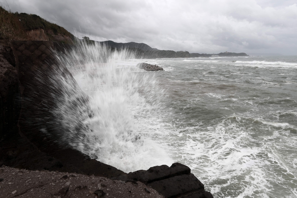 Waves hit the seawalls at a coast of Shibushi city, Kagoshima prefecture, on Kyushu island, on September 29, 2018, as typhoon Trami approaches. AFP / Behrouz Mehri 