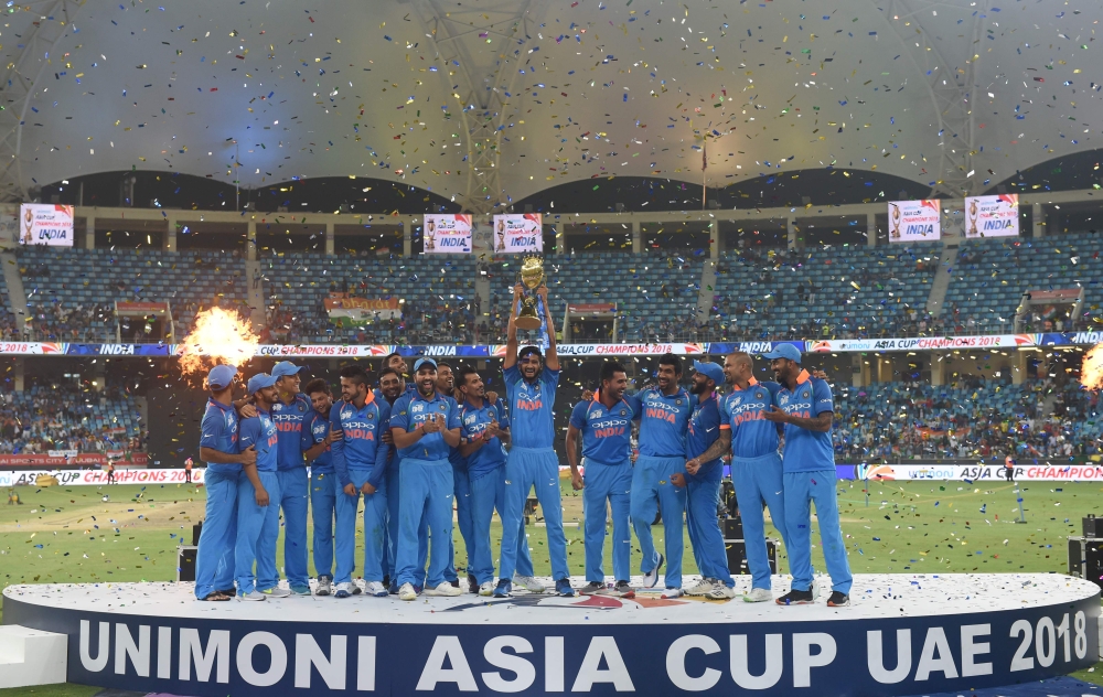Indian Cricket team celebrates after won during the final one day international (ODI) Asia Cup cricket match between Bangladesh and India at the Dubai International Cricket Stadium in Dubai on September 28, 2018. / AFP / ISHARA S. KODIKARA